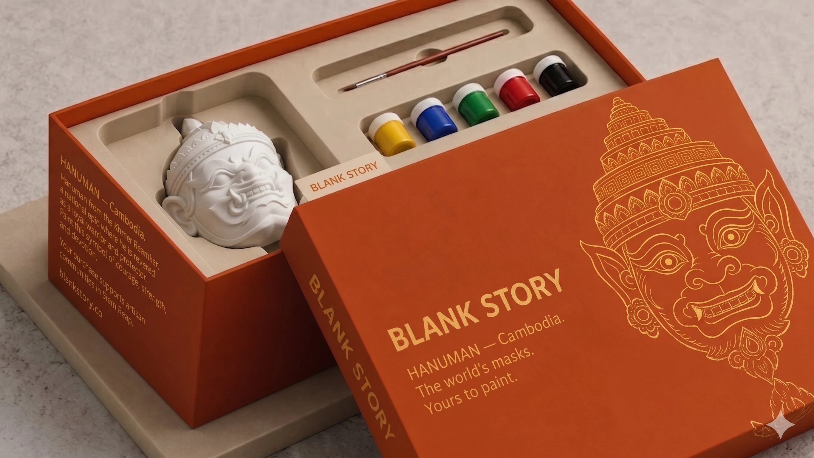 Hanuman BLANK Story mask painting kit, open box showing white plaster mask, five paint pots, and brush